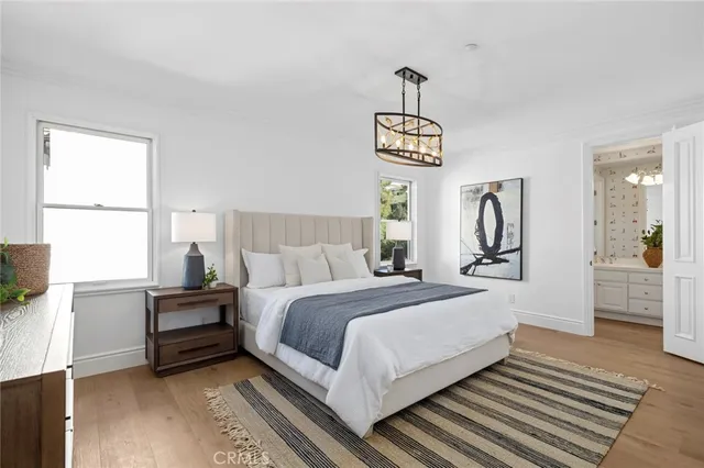 a bedroom with a large bed and a window