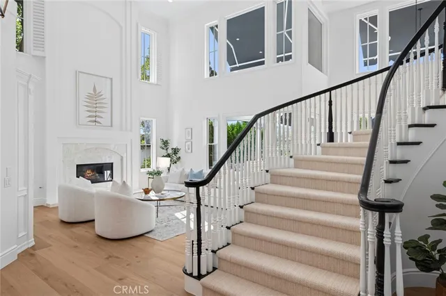a living room with furniture a rug and a fireplace
