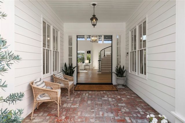 a living room with furniture a fireplace and a table