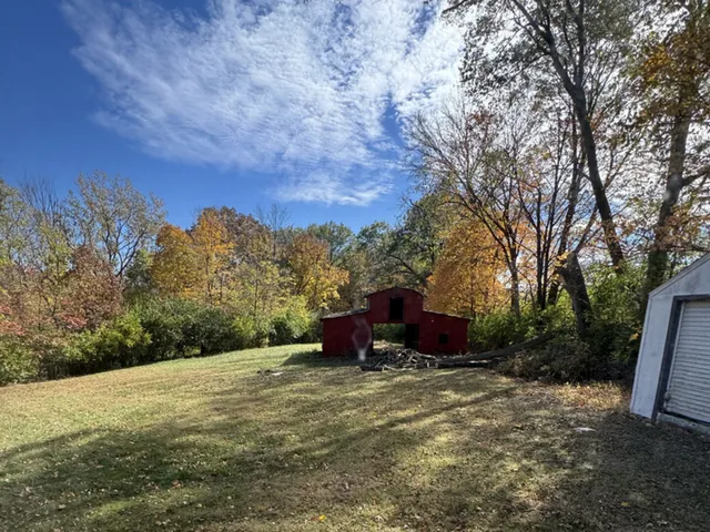 a backyard of a house with lots of green space