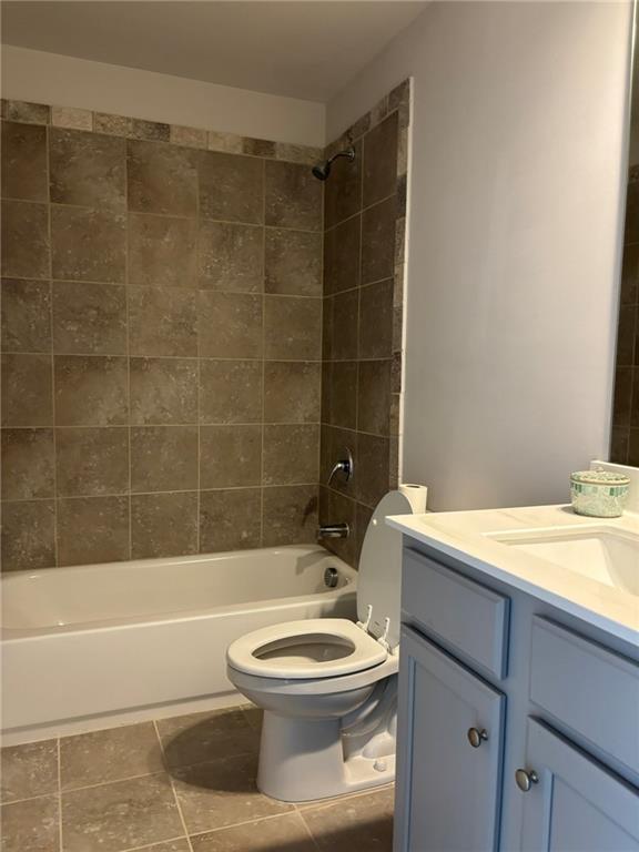 11208 Benton Loop Covington, GA 30014 - Photo 10 of 16 a bathroom with a toilet a sink and bathtub