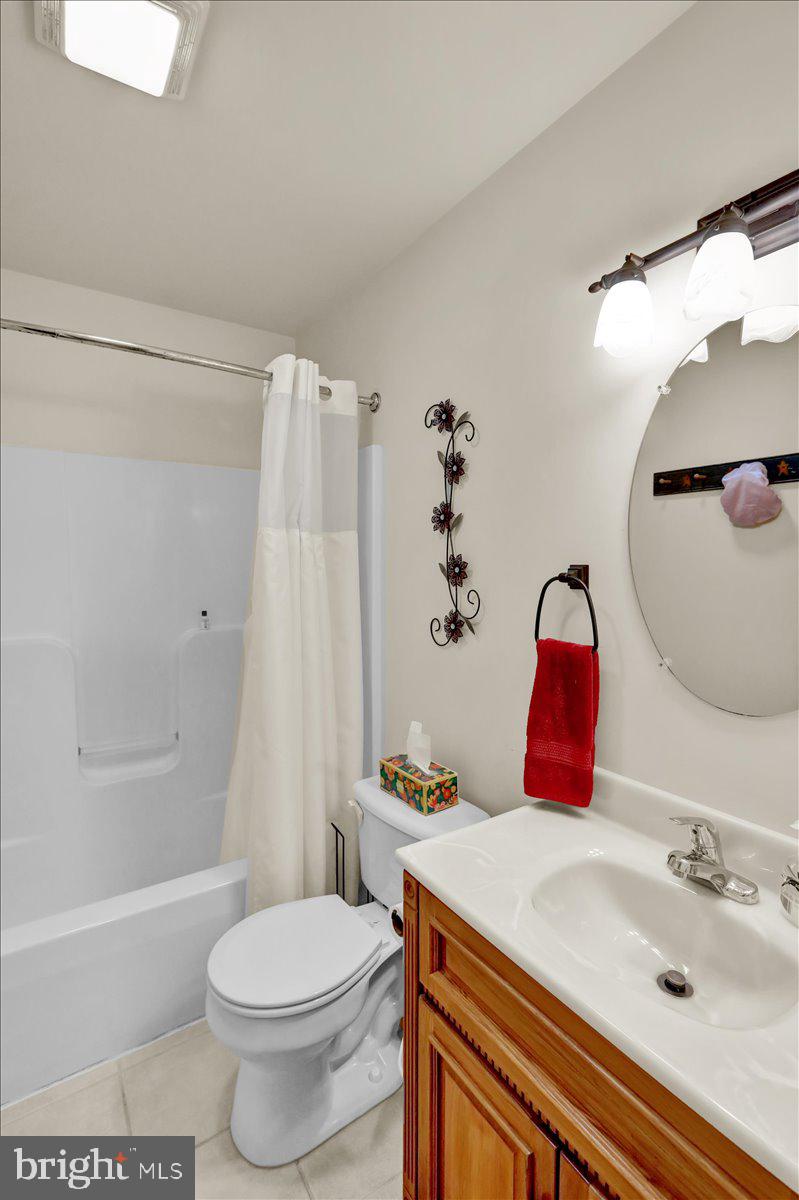 1060 Shelbourne Road Reading, PA 19606 - Photo 25 of 30 a bathroom with a sink toilet and shower