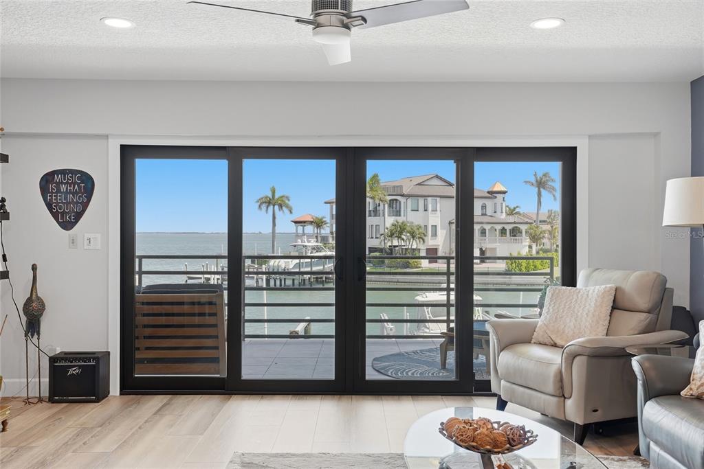 363 Pinellas Bayway South, Unit 29 Tierra Verde, FL 33715 - Photo 11 of 59 a living room with furniture and a window