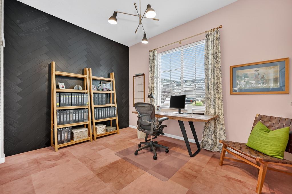 3900 Fenway Circle Rocklin, CA 95677 - Photo 28 of 57 Guest bedroom currently used as home office with unique wood herringbone accent wall.