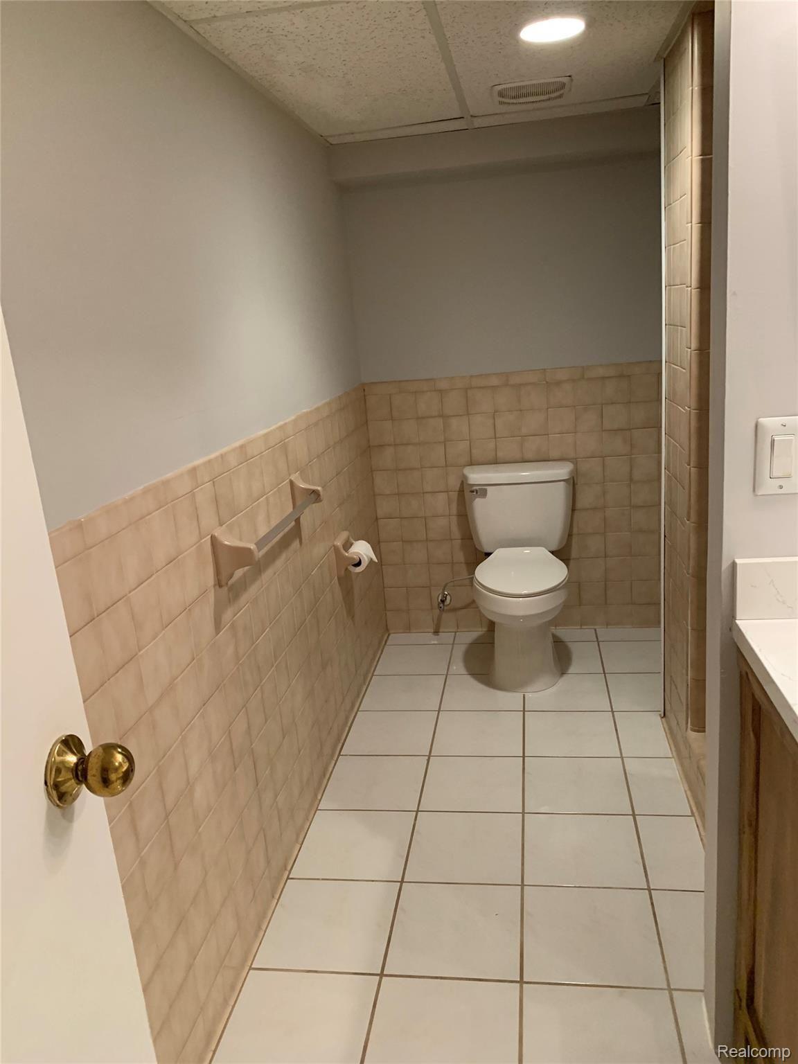 4859 Crooked Lake Road Howell, MI 48843 - Photo 51 of 90 Full Basement bathroom - New Toilet with ceramic flooring