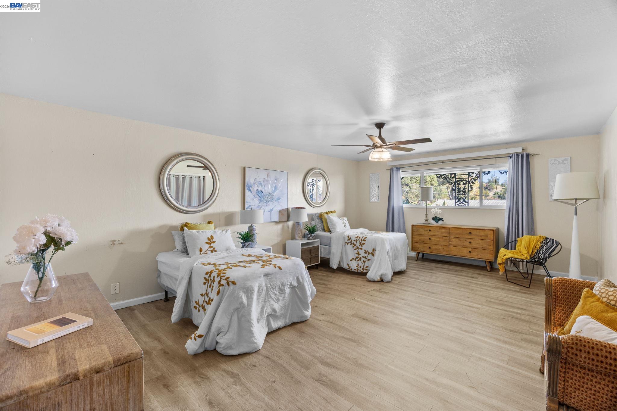 a living room with furniture chandelier and window