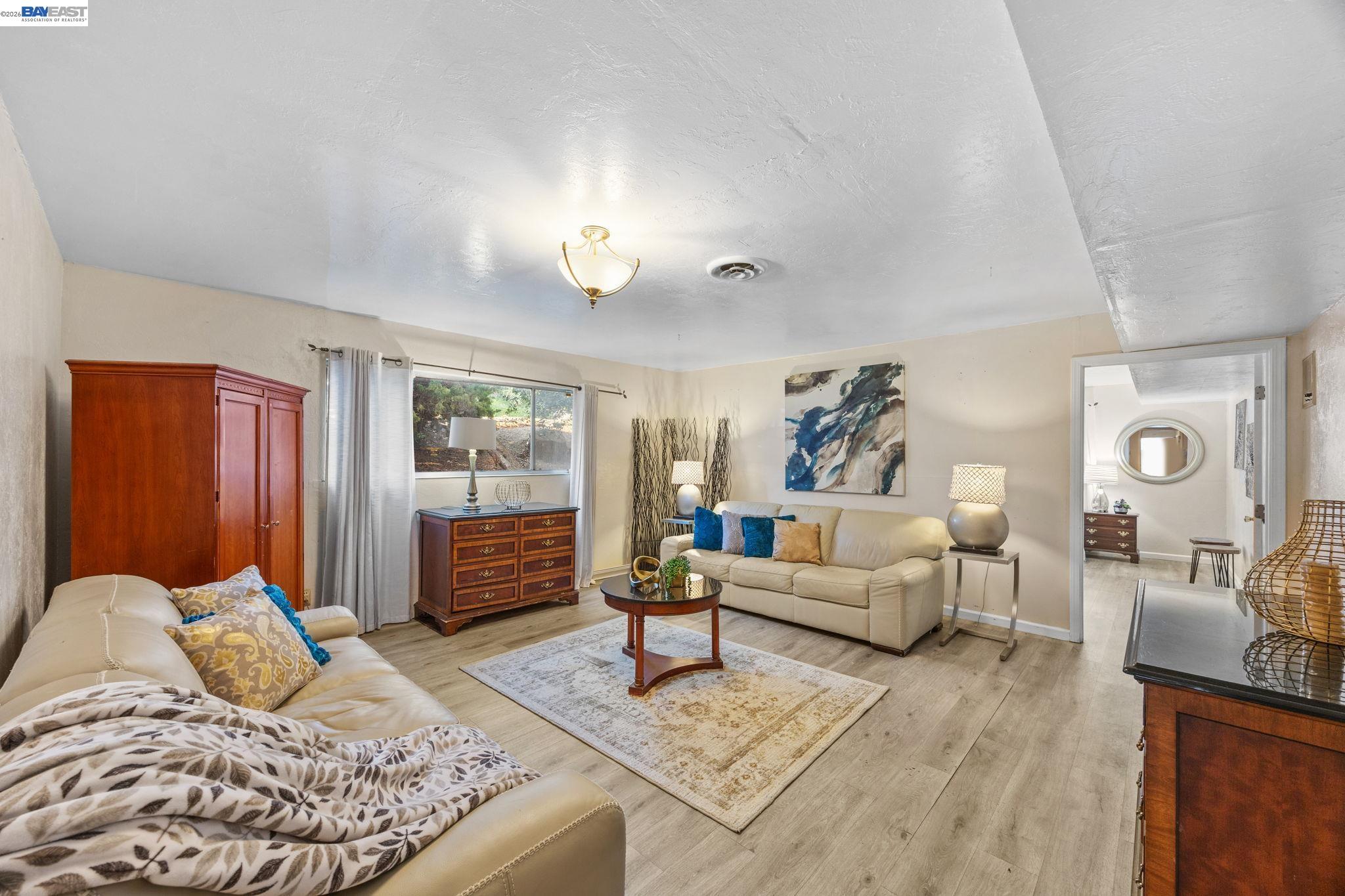 2245 Sol Street Castro Valley, CA 94578 - Photo 17 of 36 a bedroom with furniture and wooden floor
