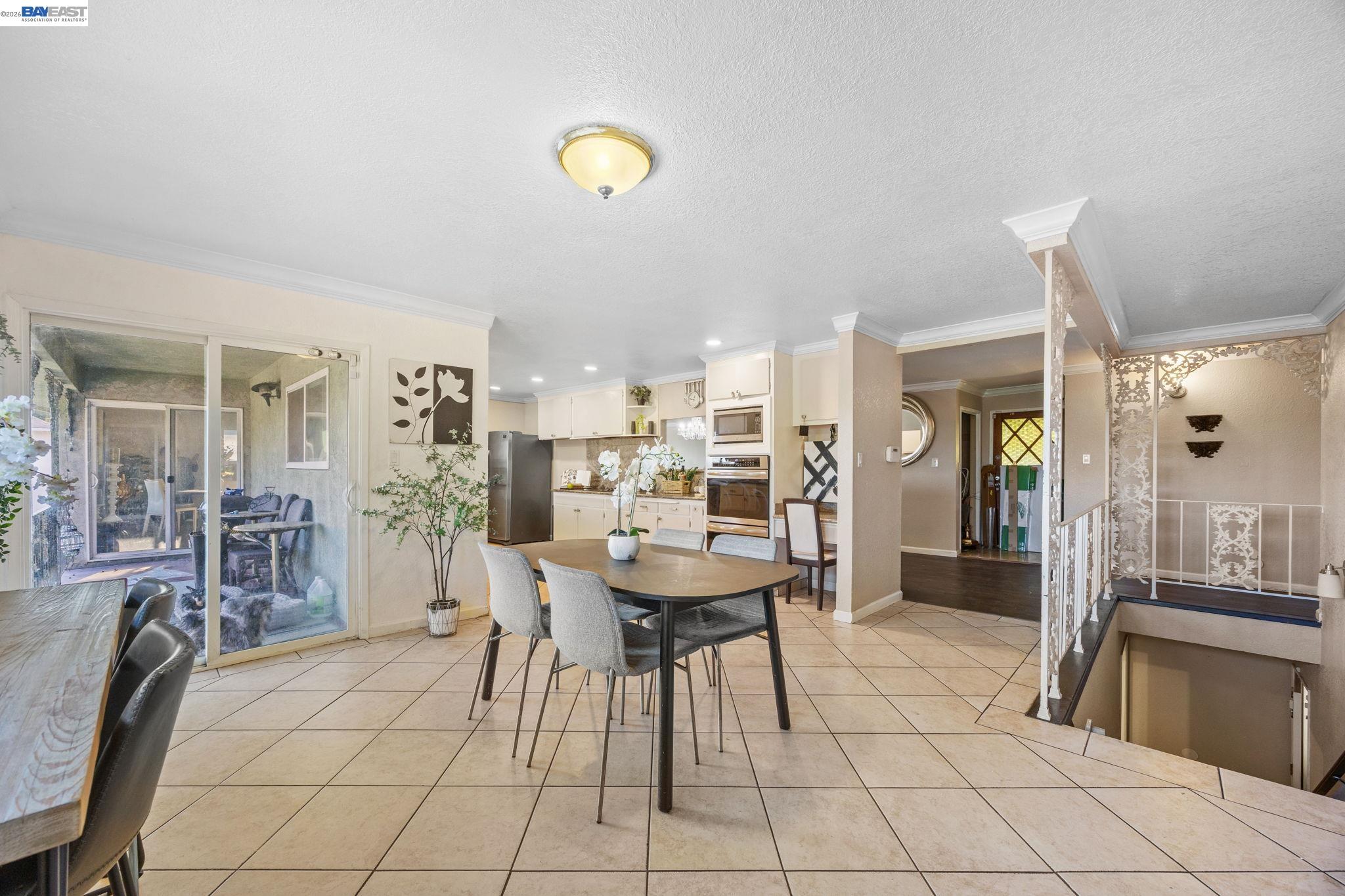 2245 Sol Street Castro Valley, CA 94578 - Photo 30 of 36 a dining room with furniture and a chandelier