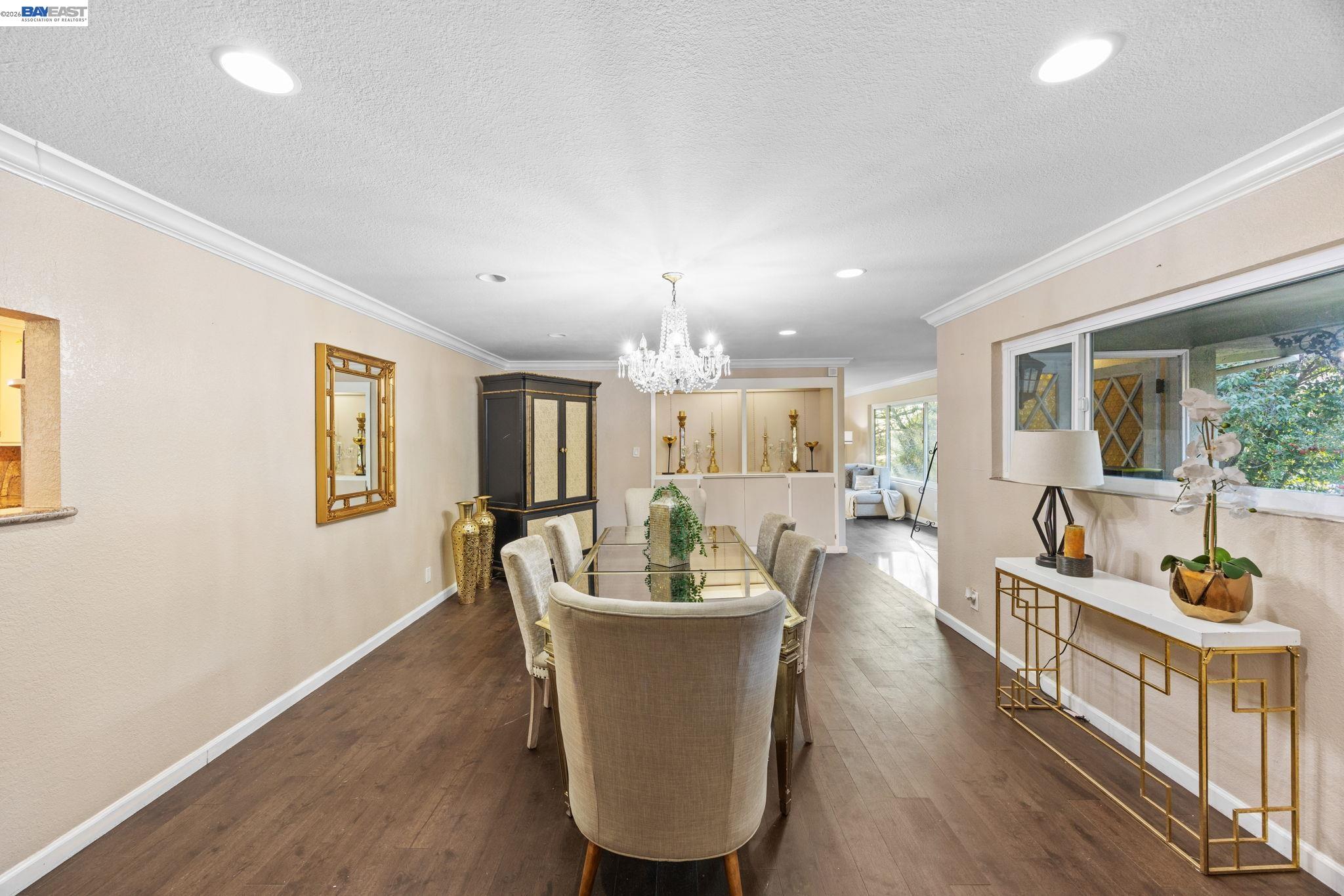 2245 Sol Street Castro Valley, CA 94578 - Photo 33 of 36 a dining room with furniture a chandelier and wooden floor