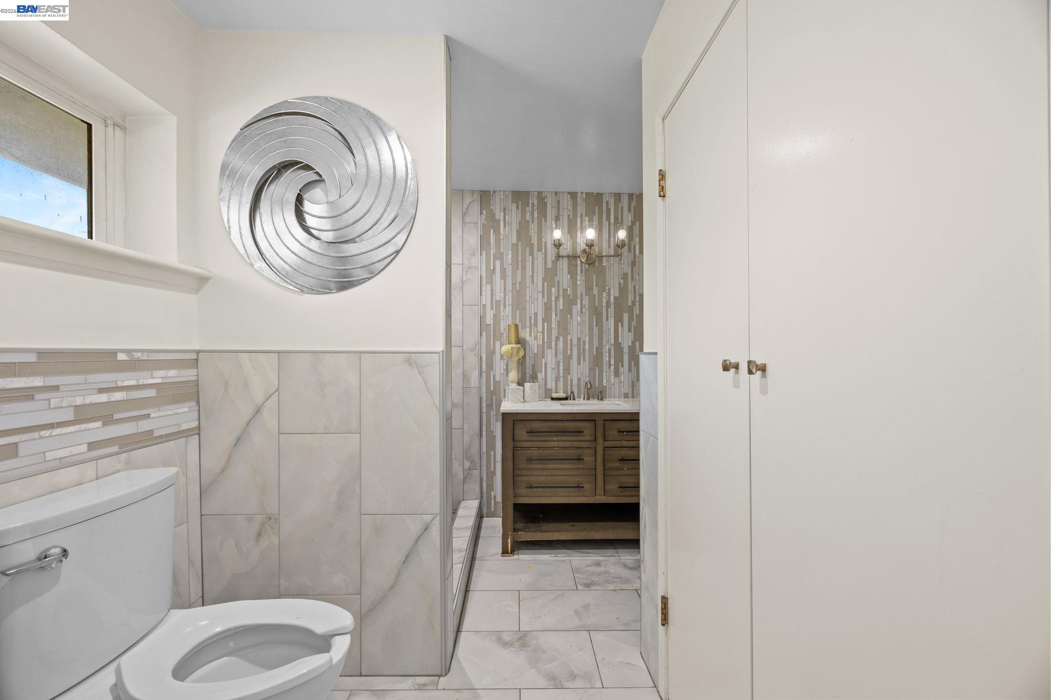 2245 Sol Street Castro Valley, CA 94578 - Photo 6 of 36 a bathroom with a toilet a sink and a shower