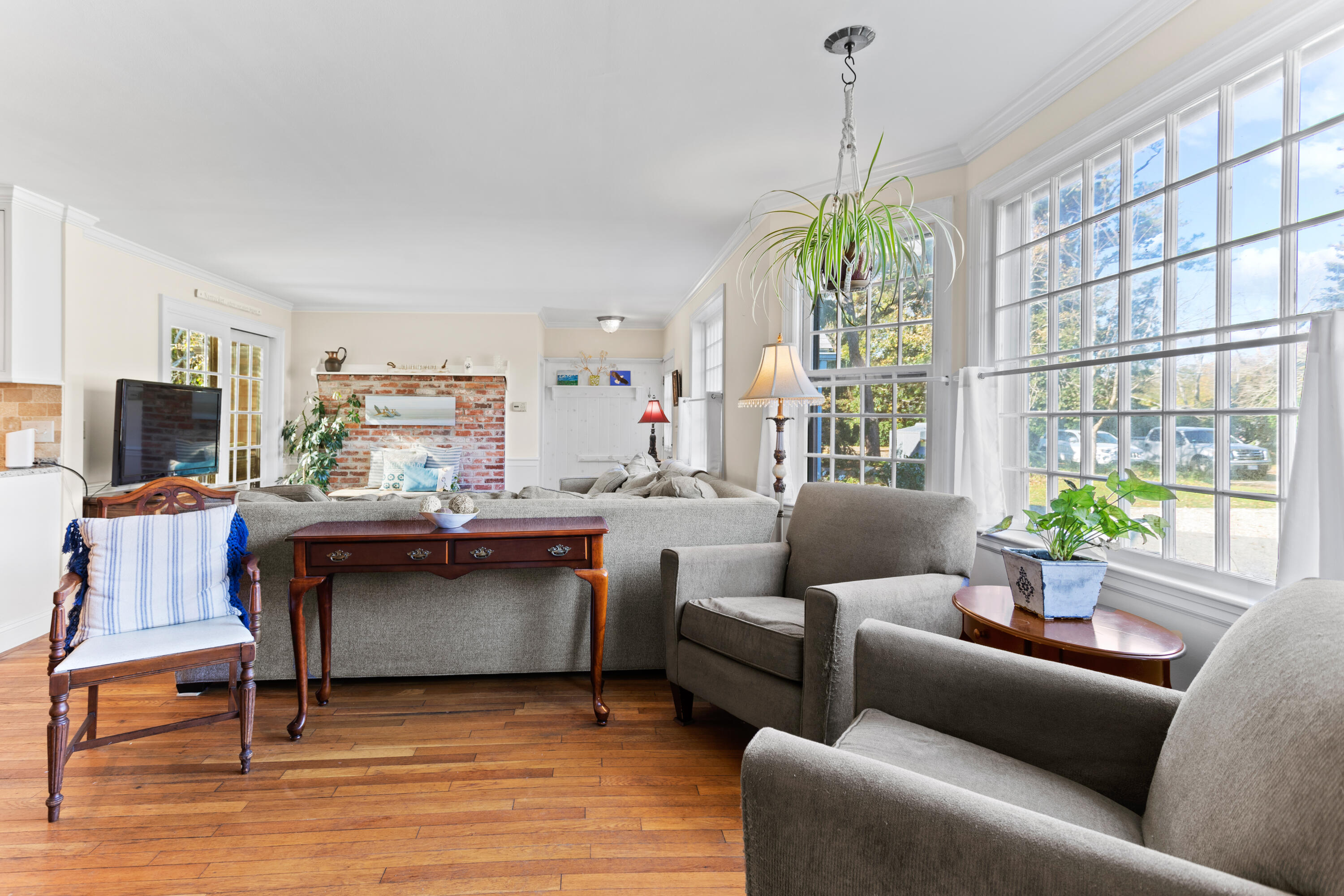 85 Stonehedge Road Barnstable, MA 02630 - Photo 16 of 41 a living room with furniture a flat screen tv and a large window