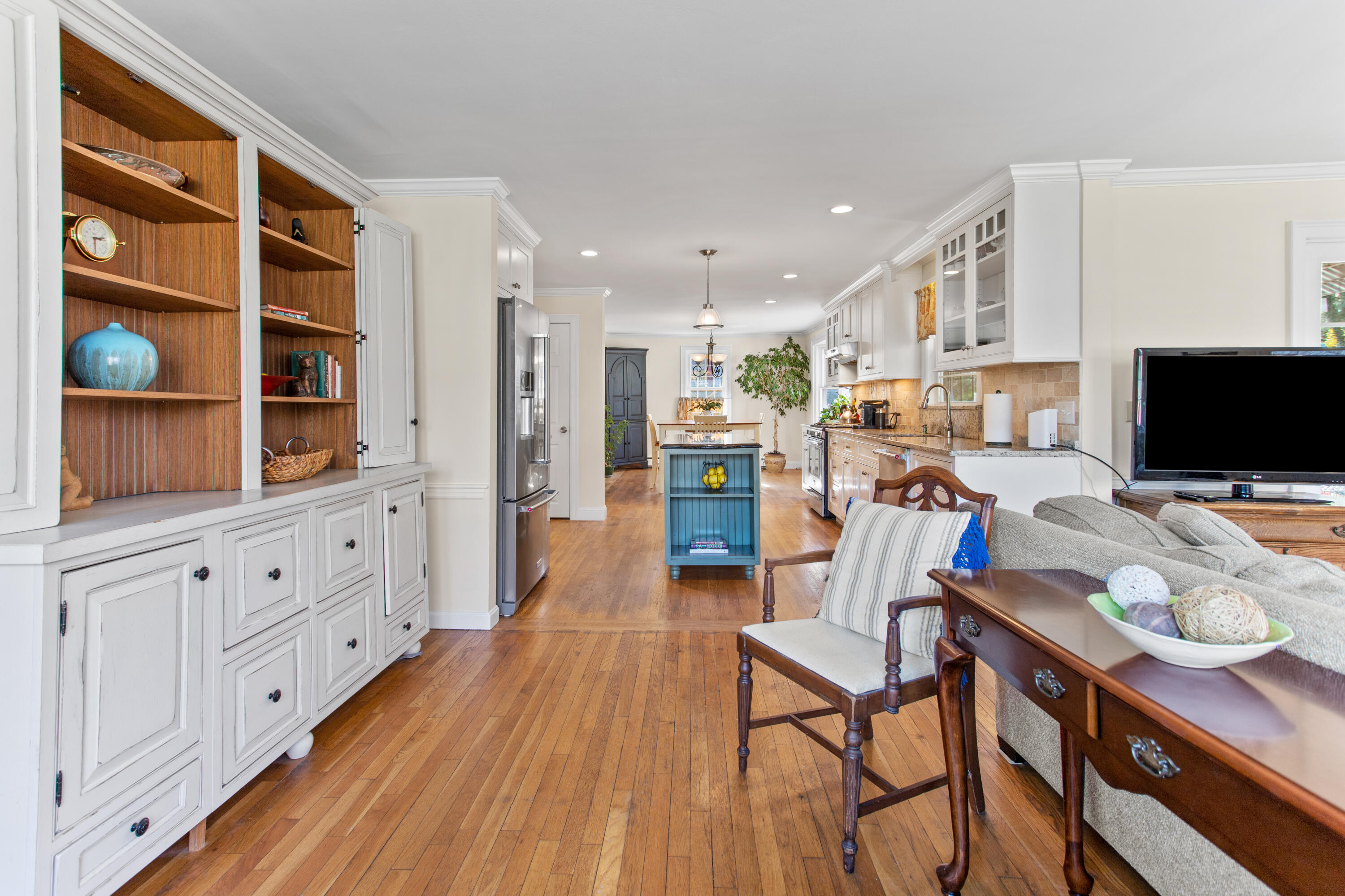 85 Stonehedge Road Barnstable, MA 02630 - Photo 20 of 41 a living room with furniture a flat screen tv and floor to ceiling window