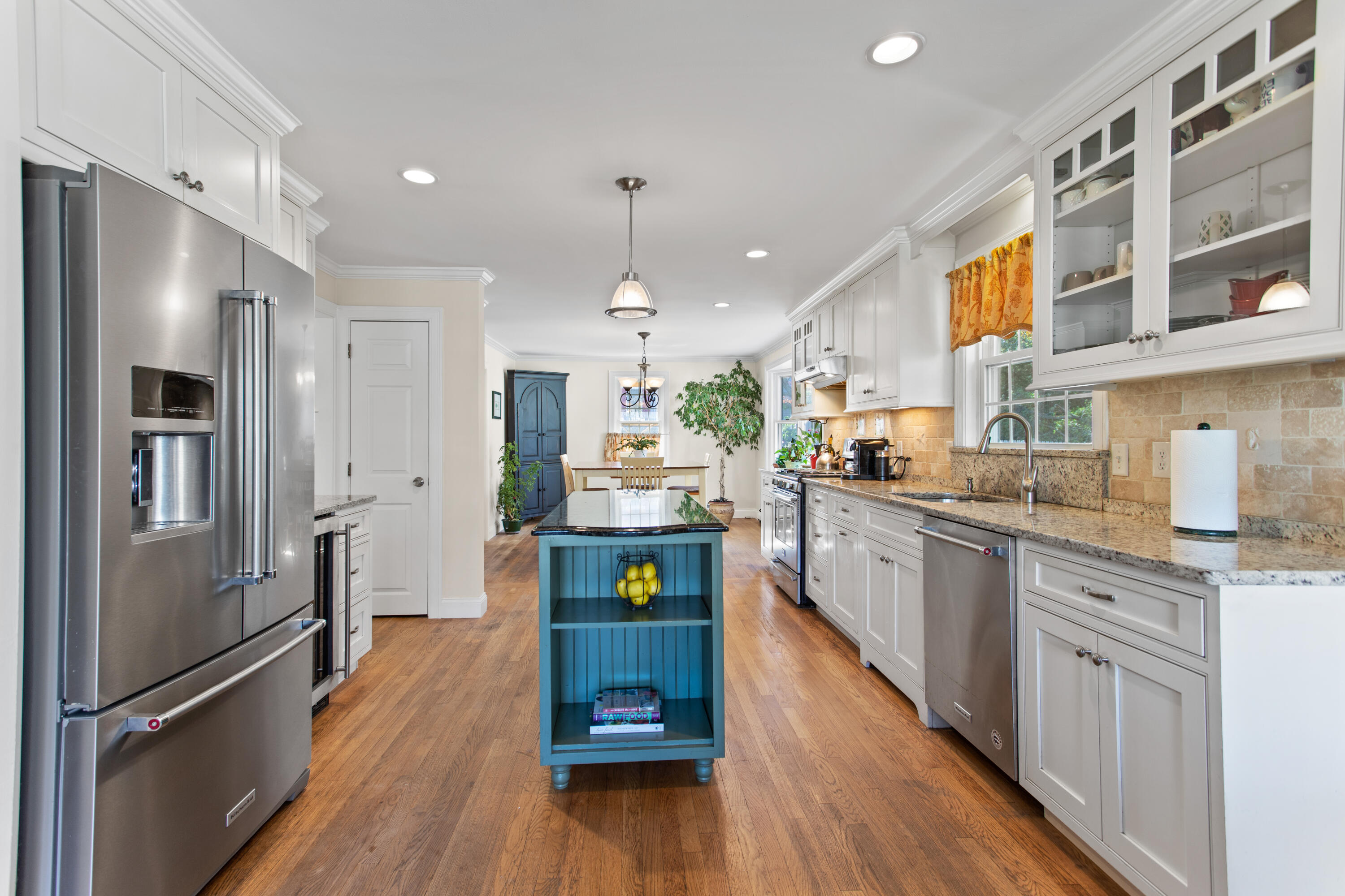 85 Stonehedge Road Barnstable, MA 02630 - Photo 21 of 41 a kitchen with stainless steel appliances granite countertop a refrigerator a stove top oven a sink dishwasher and white cabinets with wooden floor