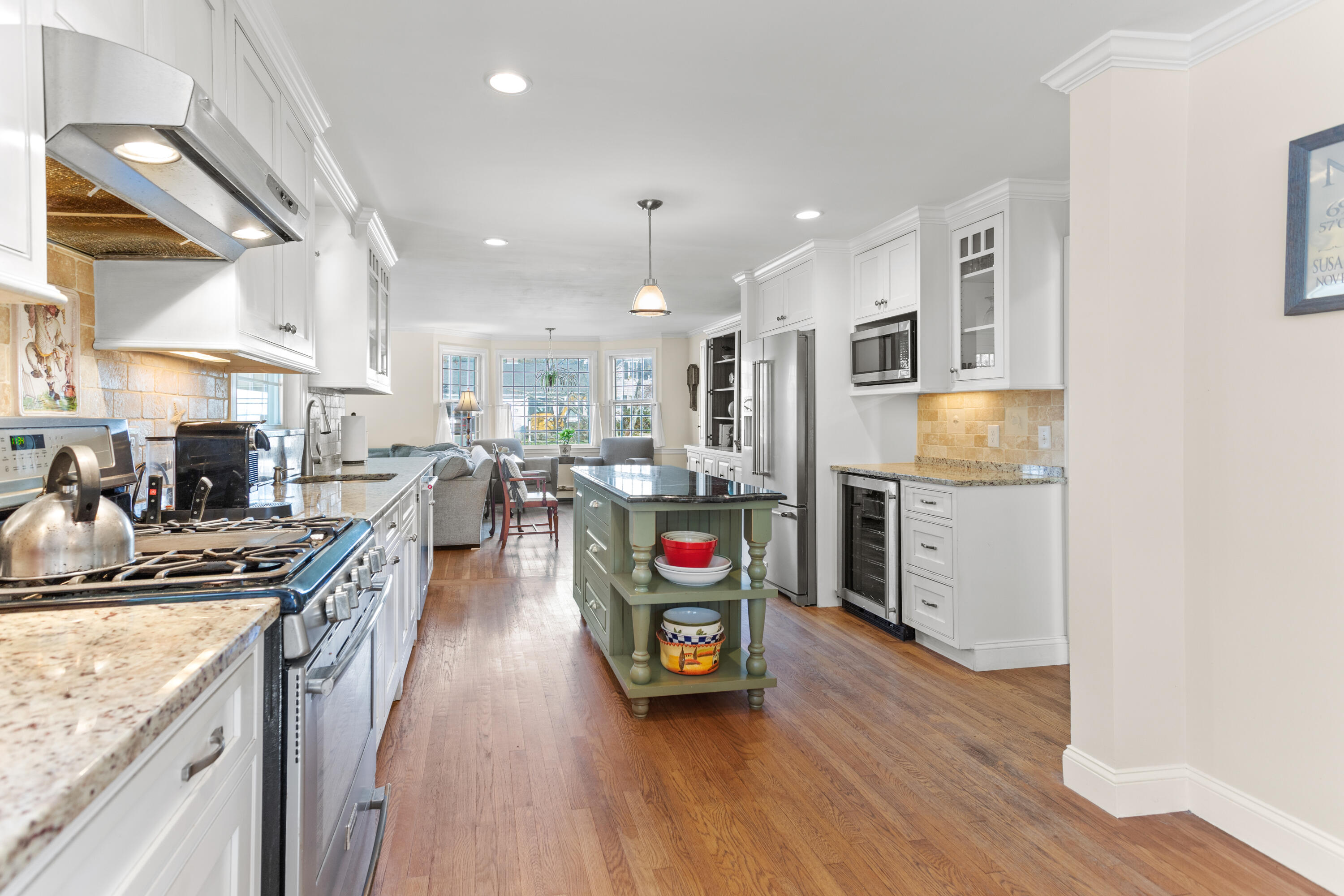 85 Stonehedge Road Barnstable, MA 02630 - Photo 22 of 41 a kitchen with stainless steel appliances granite countertop wooden cabinets a sink a stove and a wooden floors