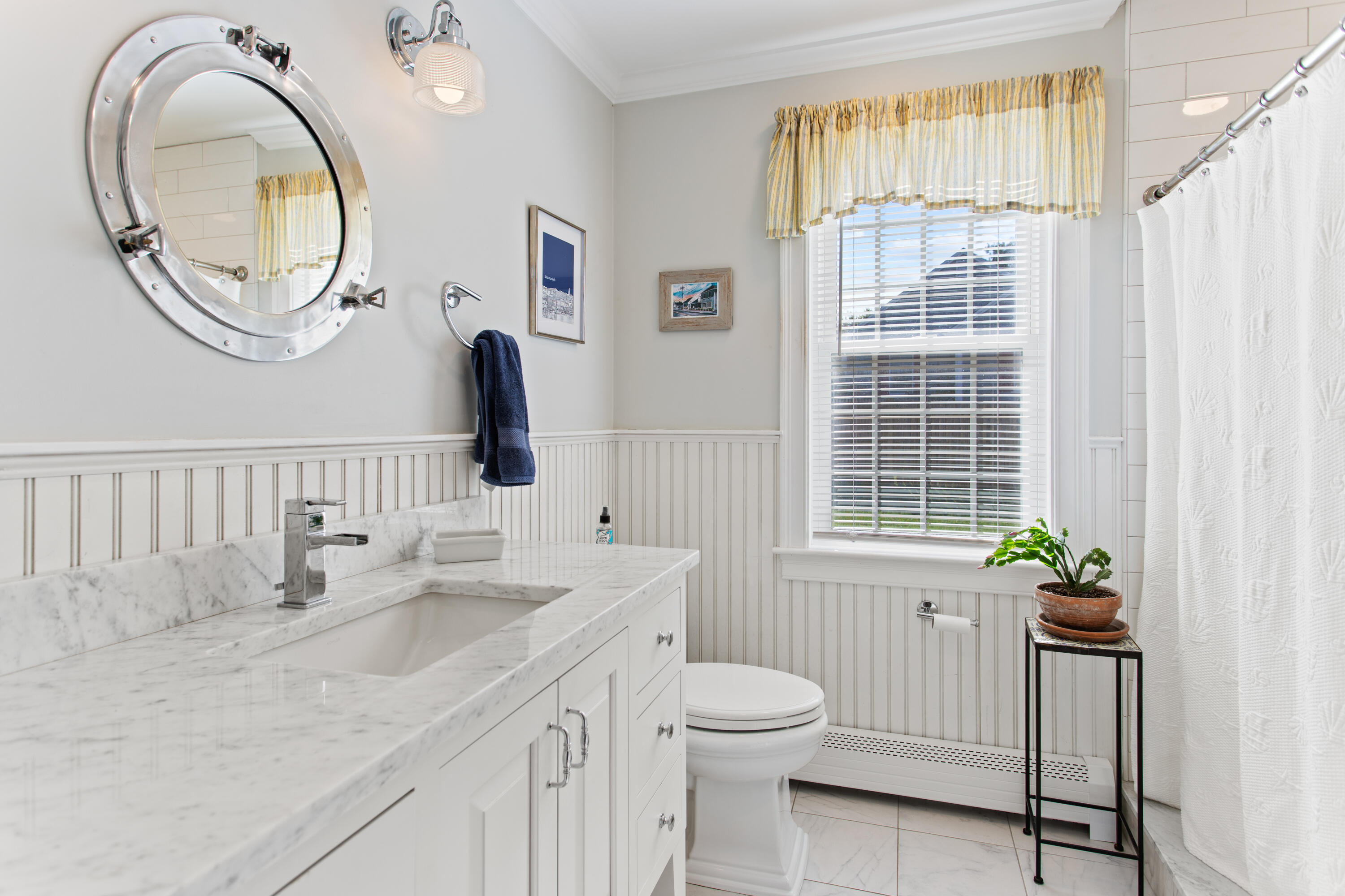85 Stonehedge Road Barnstable, MA 02630 - Photo 26 of 41 a bathroom with a granite countertop sink a mirror a vanity and a window