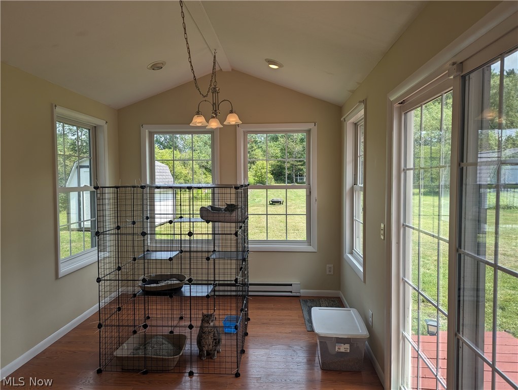 12781 Caves Road Chesterland, OH 44026 - Photo 10 of 28 Laminate floors, vaulted ceiling & door to deck