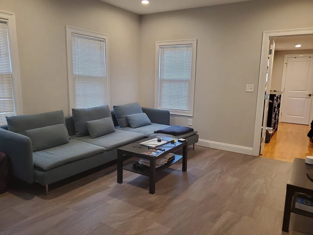 6 Florence Street, Unit 2 Somerville, MA 02145 - Photo 5 of 8 a living room with furniture and a wooden floor