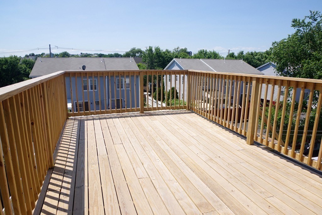 6 Florence Street, Unit 2 Somerville, MA 02145 - Photo 8 of 8 a balcony with wooden floor