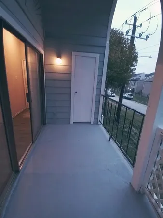 a bathroom with a white toilet a sink and a shower