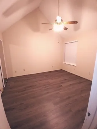 an empty room with wooden floor