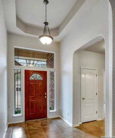 a view of a hallway with a washer and dryer