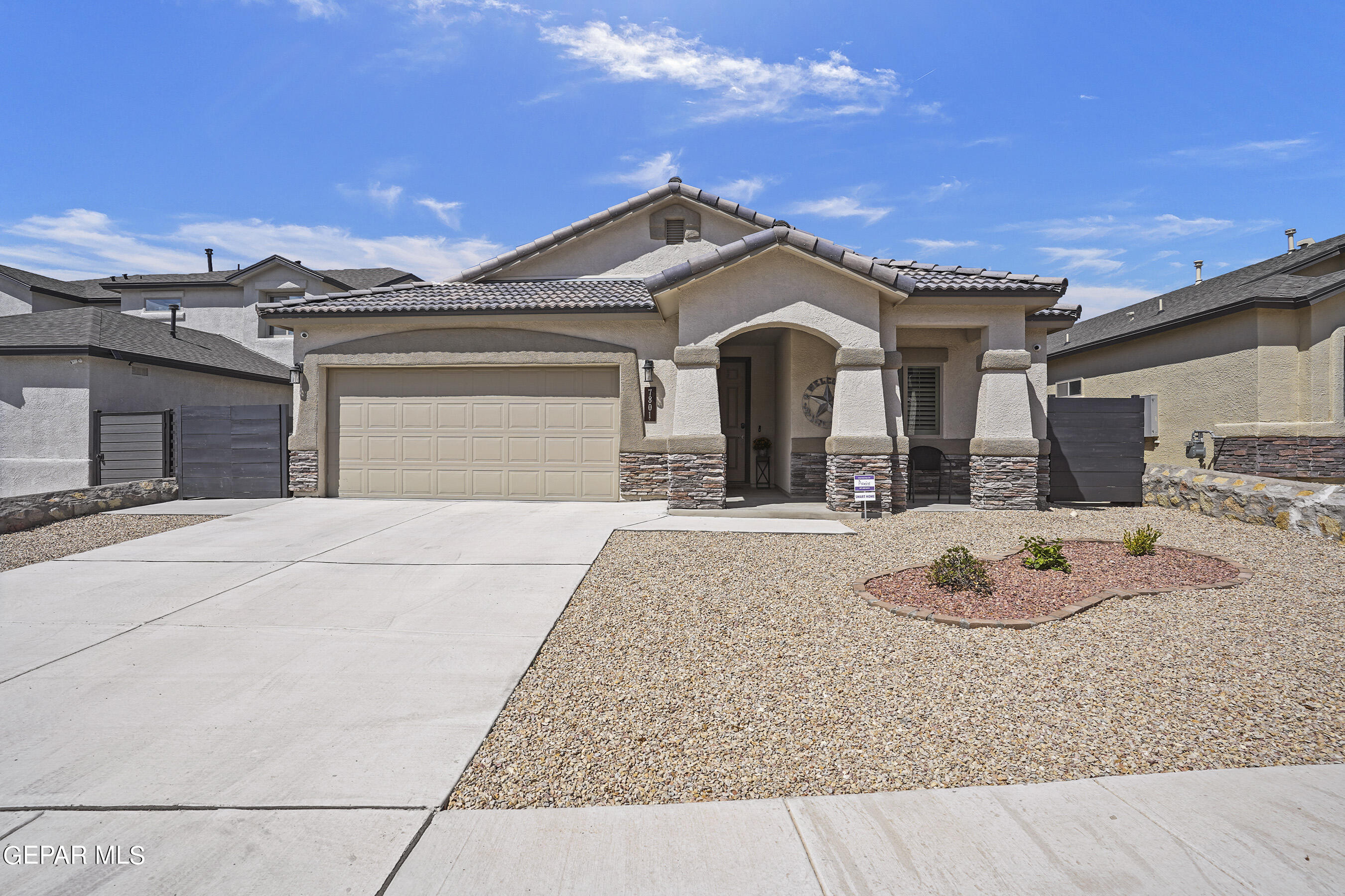 a front view of a house with a garage