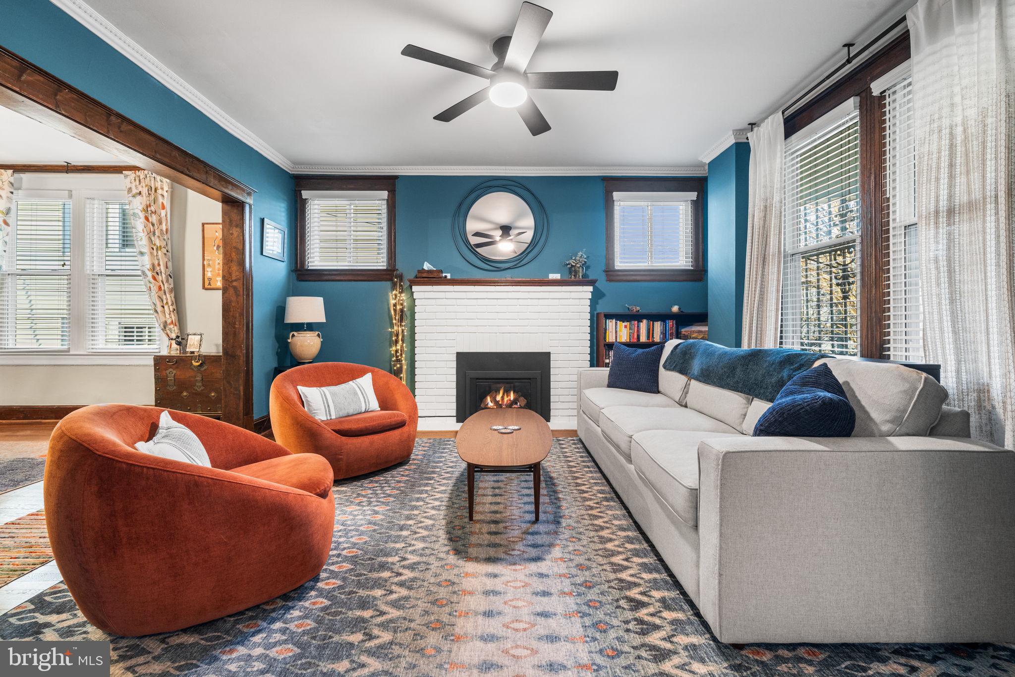1227 Talbert Street Southeast Washington, DC 20020 - Photo 11 of 64 a living room with furniture a large window and a fireplace