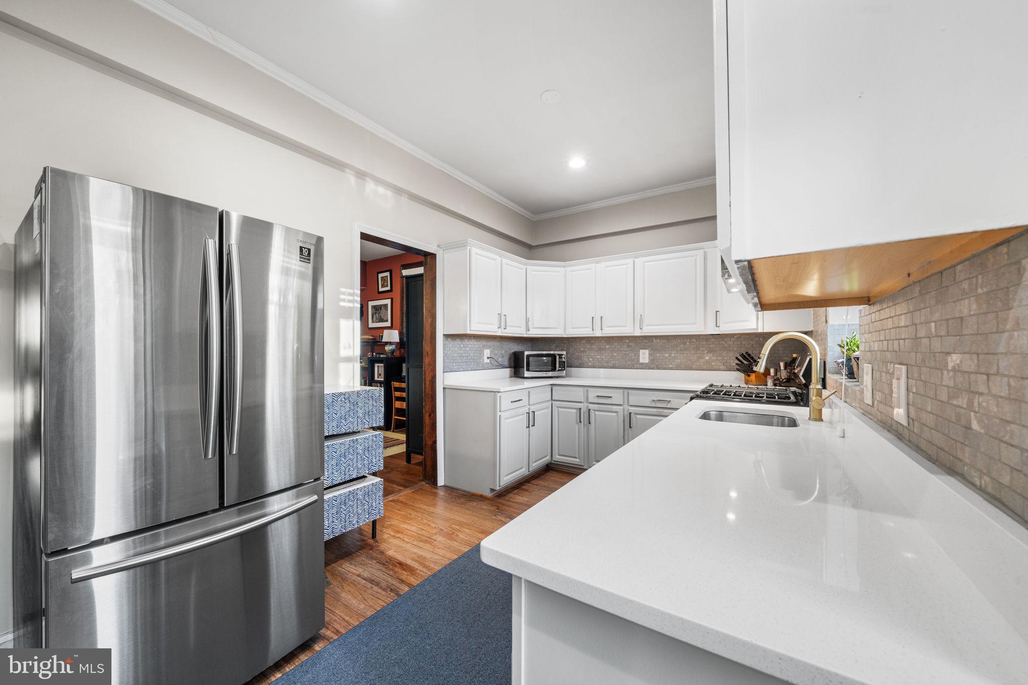 1227 Talbert Street Southeast Washington, DC 20020 - Photo 24 of 64 a kitchen with stainless steel appliances a refrigerator sink and cabinets