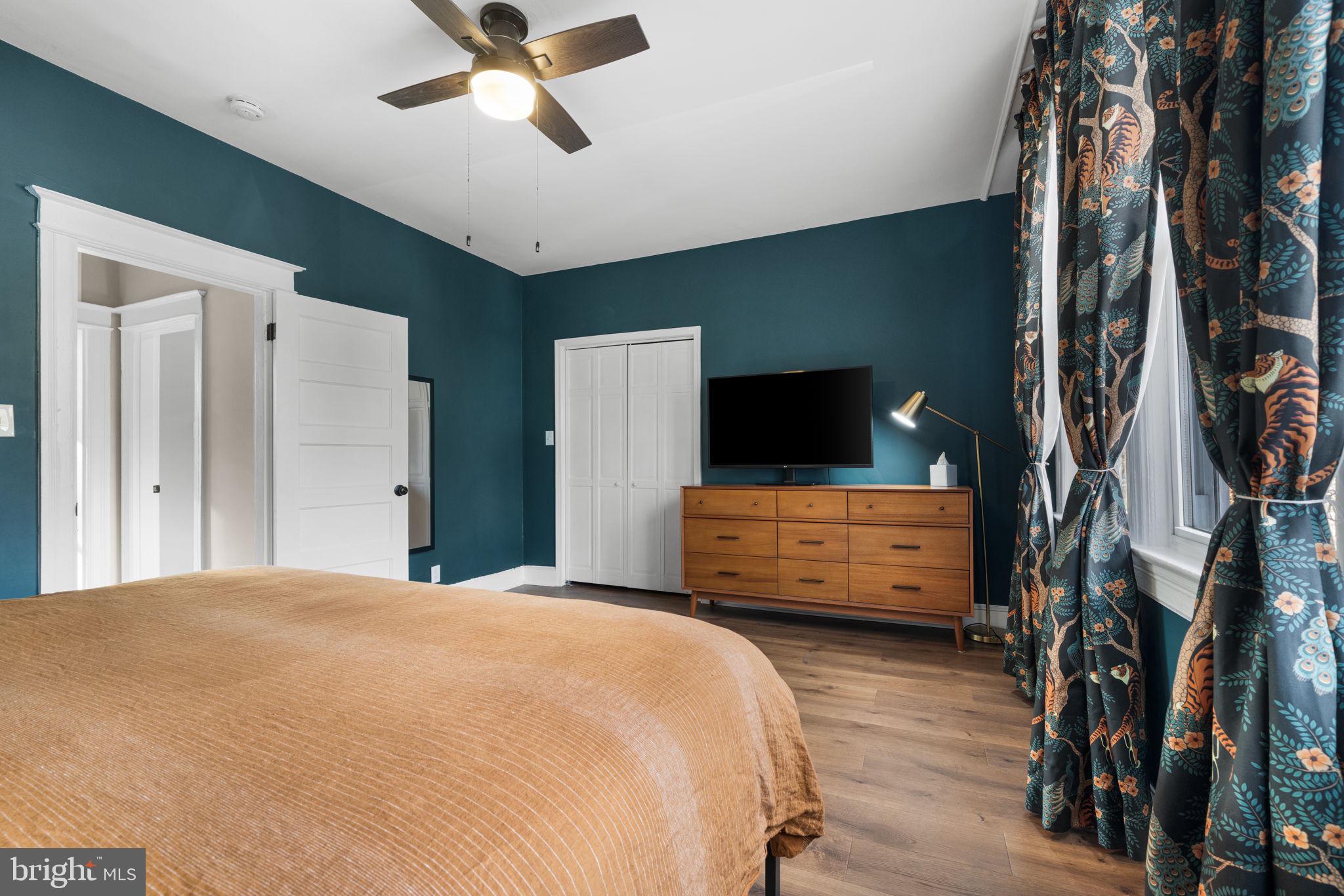 1227 Talbert Street Southeast Washington, DC 20020 - Photo 34 of 64 a bedroom with a bed and a flat tv screen