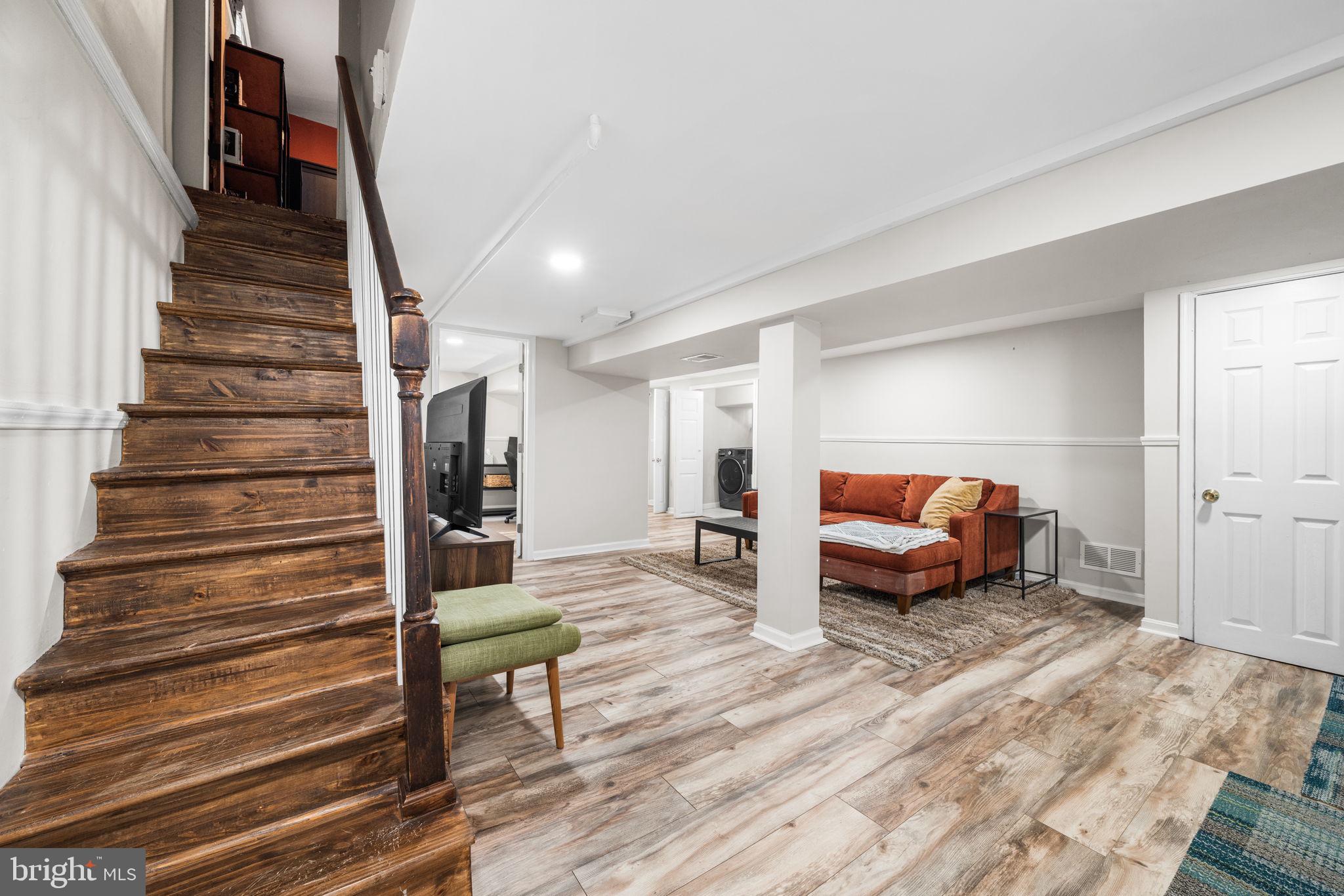 1227 Talbert Street Southeast Washington, DC 20020 - Photo 43 of 64 a living room with furniture and a wooden floor