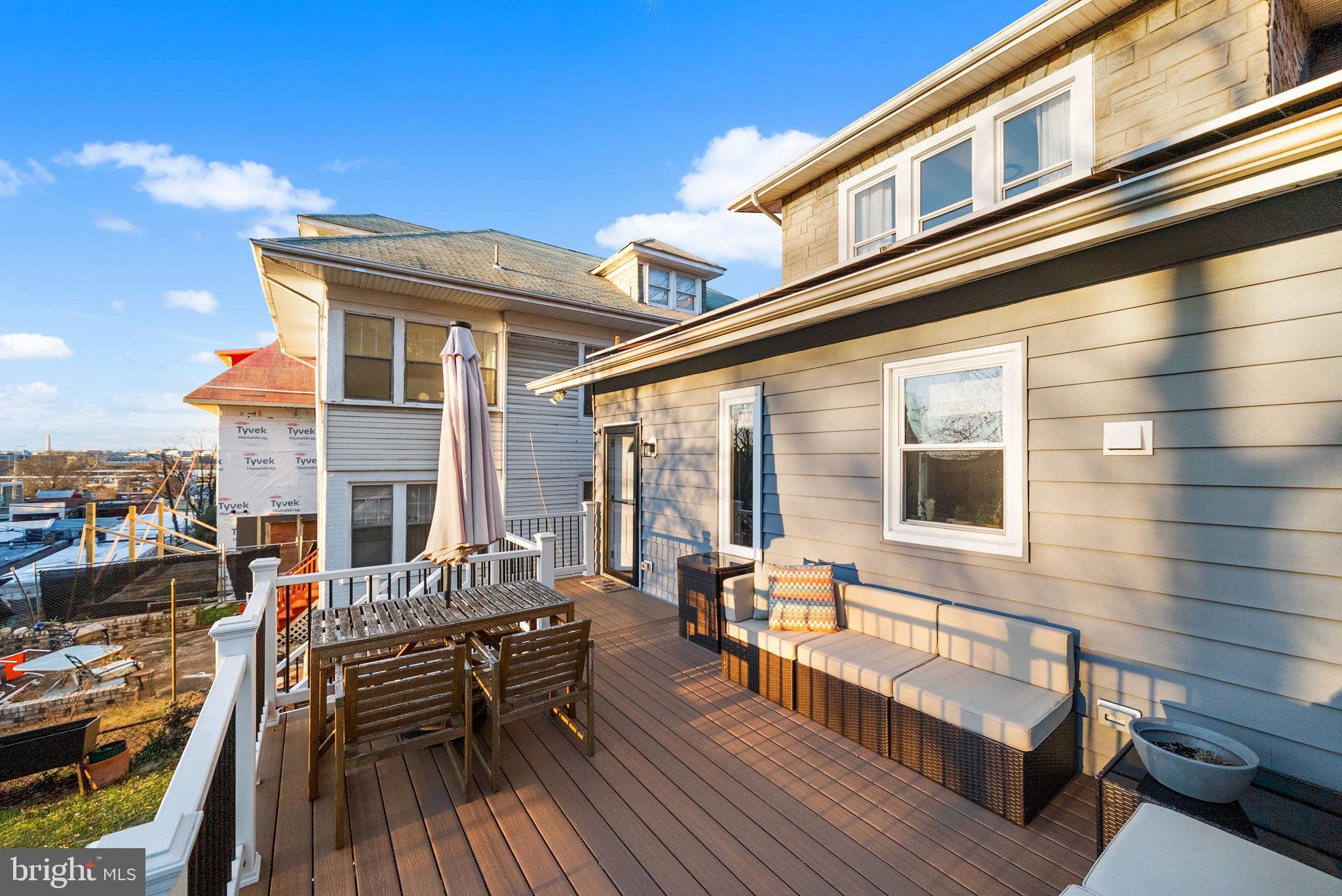 1227 Talbert Street Southeast Washington, DC 20020 - Photo 53 of 64 a view of a patio with couches chairs and wooden floor