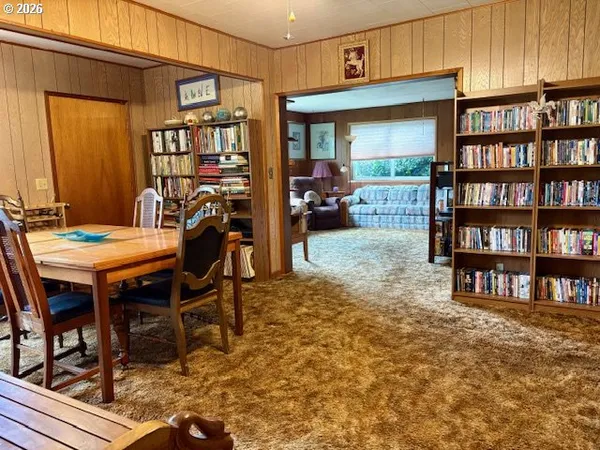 a view of a livingroom with furniture and breakfast area