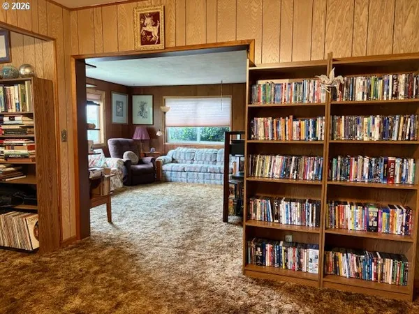 a living room with a book shelf