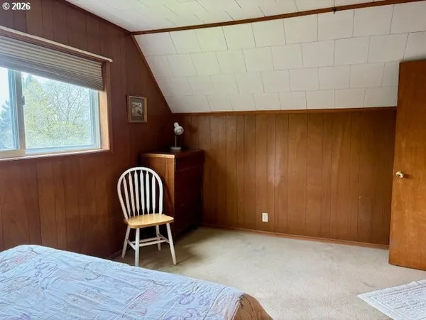 a view of a room with furniture and windows