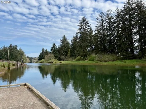 a view of a lake with a yard