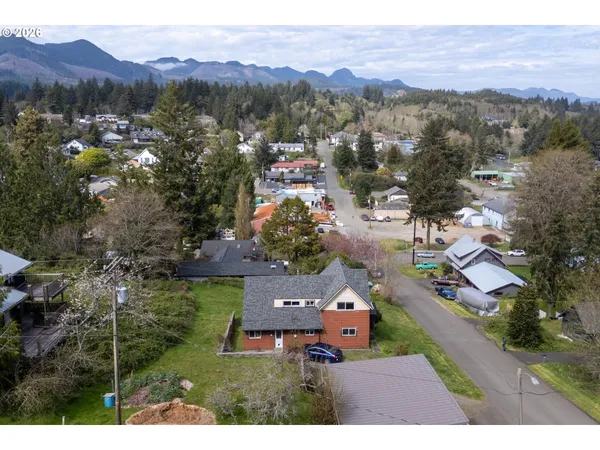 an aerial view of residential house with outdoor space and mountain view