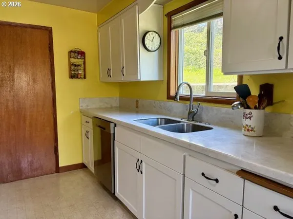 a kitchen with a sink and a window