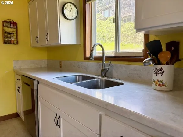 a kitchen with a sink and a window