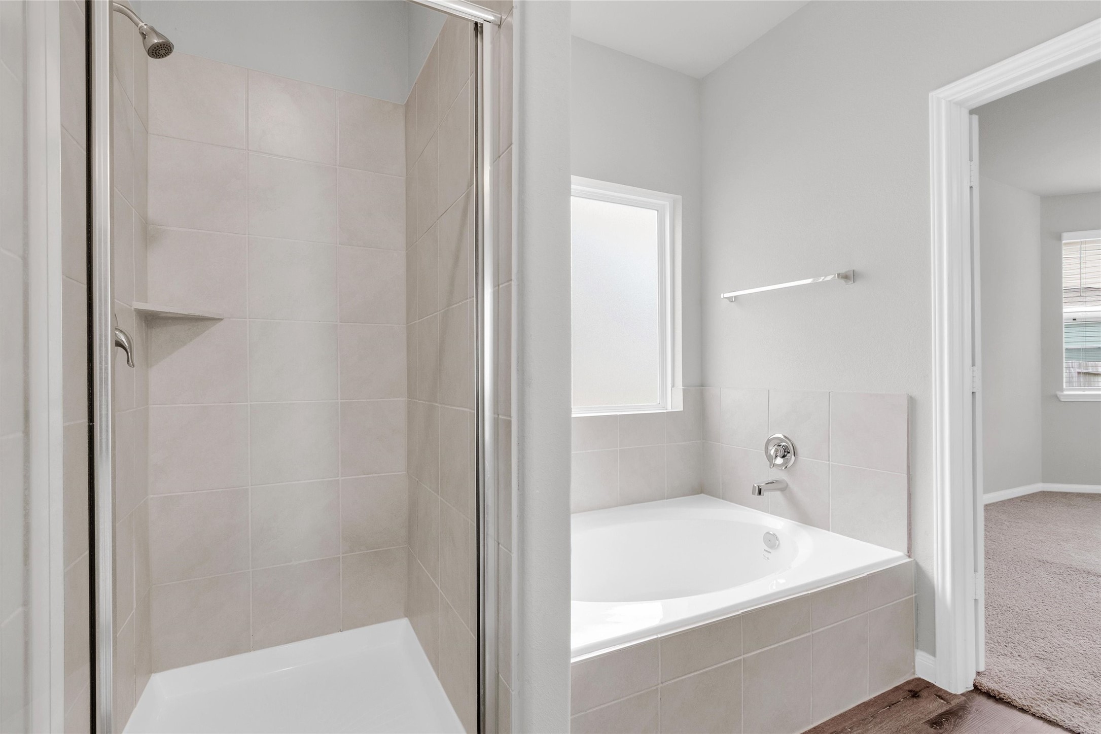 13534 Luke Prairie Willis, TX 77378 - Photo 18 of 29 Walk-in shower and large soaker tub located in the primary bathroom.