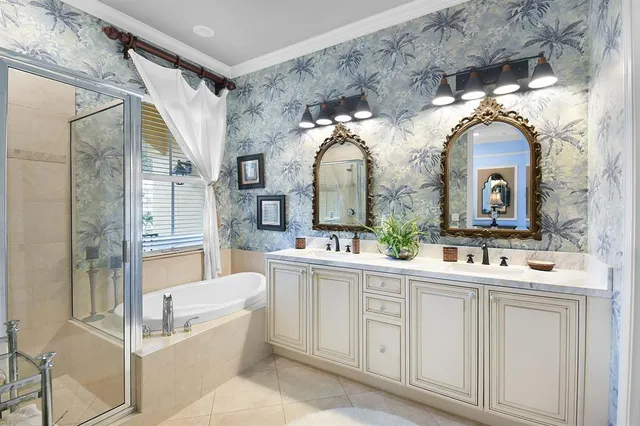 a bathroom with a double vanity sink mirror and bathtub