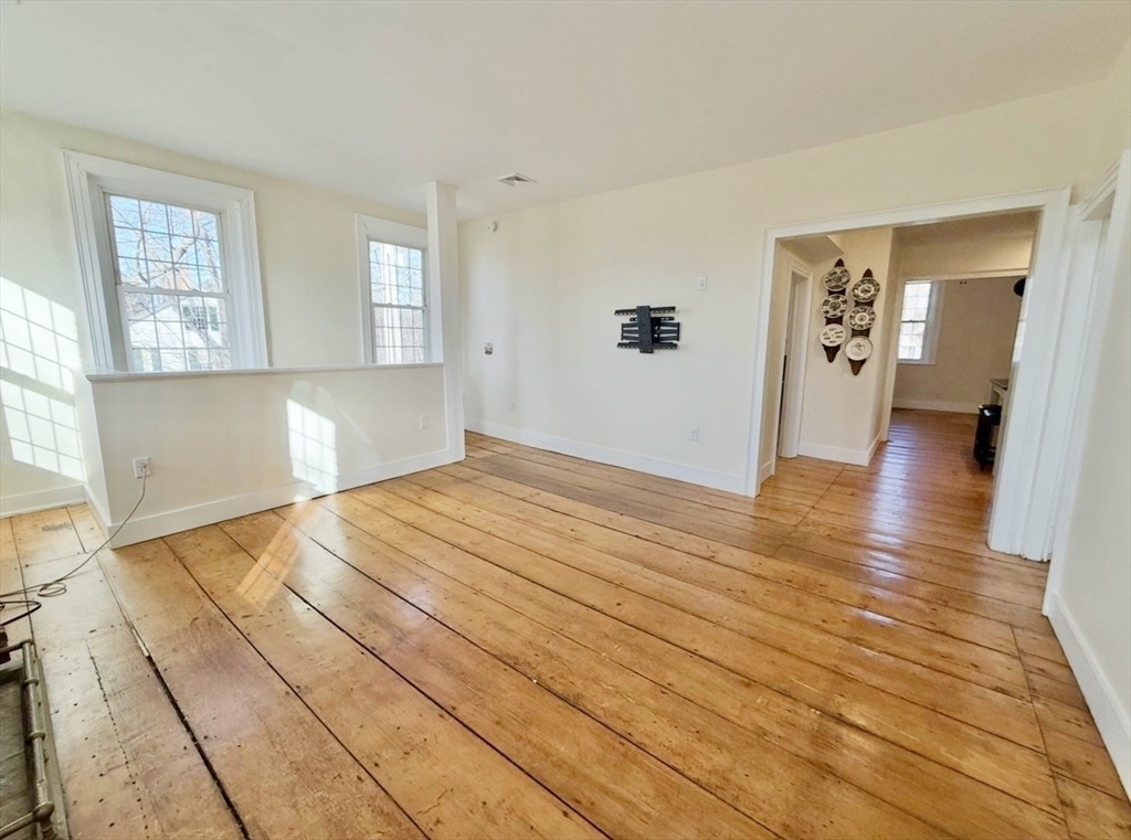 278 East Main Street Plainfield, MA 01070 - Photo 13 of 33 a view of empty room with wooden floor and fan