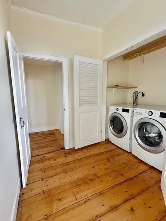 a view of a kitchen with washer and dryer