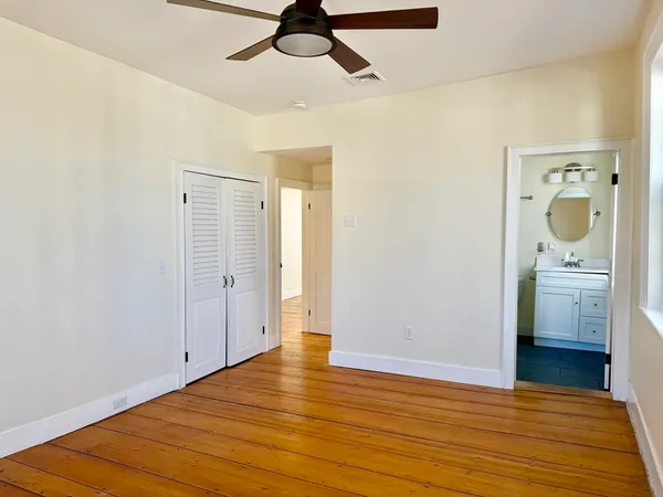 a view of a storage & utility room with wooden floor