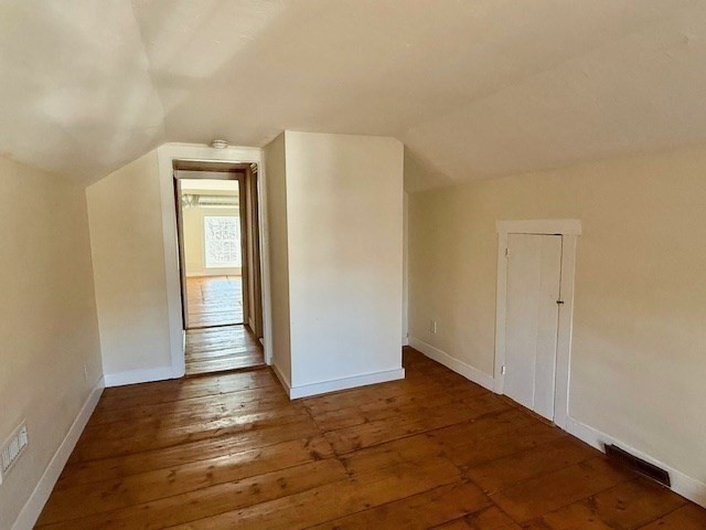 278 East Main Street Plainfield, MA 01070 - Photo 21 of 33 an empty room with wooden floor and windows