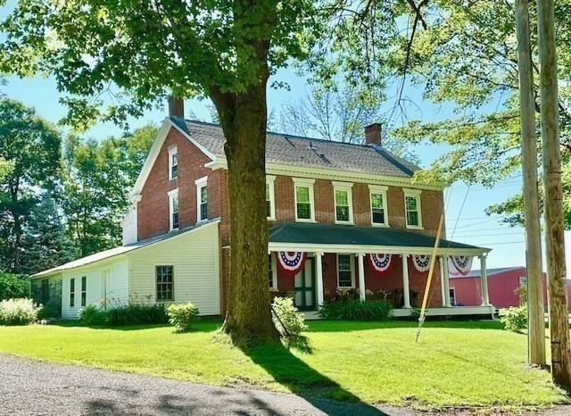 278 East Main Street Plainfield, MA 01070 - Photo 3 of 33 a view of a brick house with a big yard plants and large trees