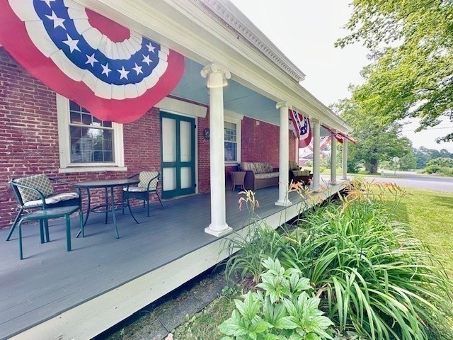 278 East Main Street Plainfield, MA 01070 - Photo 4 of 33 a view of a chairs and table in the patio