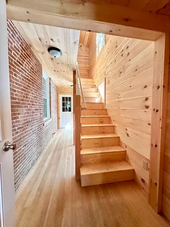 a view of entryway with wooden floor