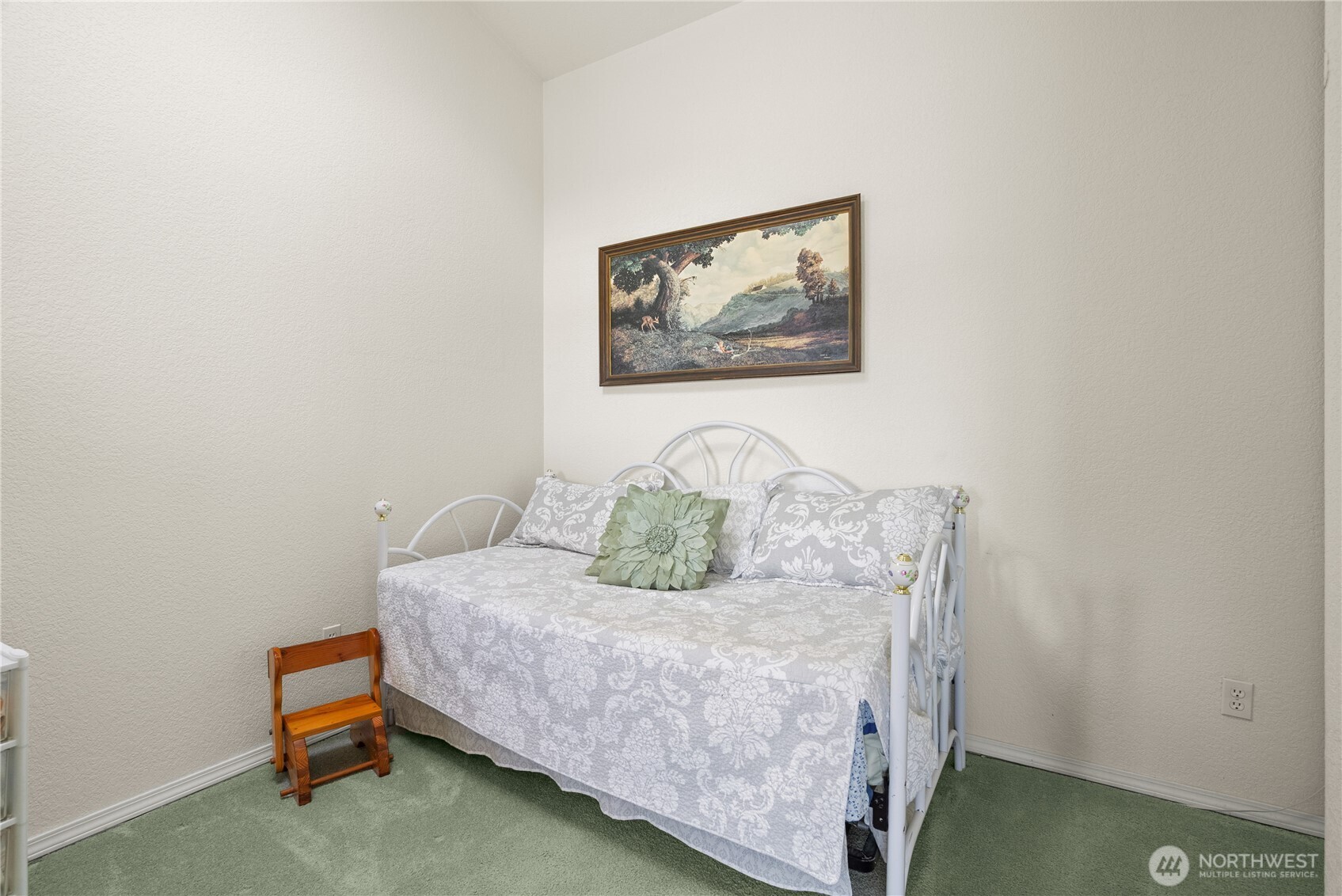 8320 East Grapeview Loop Road Allyn, WA 98524 - Photo 23 of 38 a bedroom with a bed and cupboard