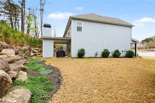 a front view of a house with garden