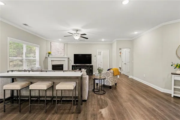 a view of a dining room with furniture window and wooden floor